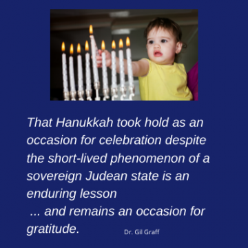 baby lighting menorah with quote from Gil Graff about Hanukkah