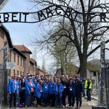 23 March of the Living group under the sign at Auschwitz