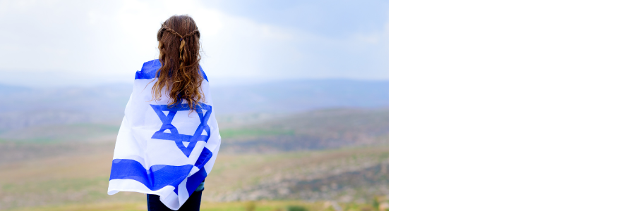 Israeli child looks over Israel with Israeli flag wrapped around her